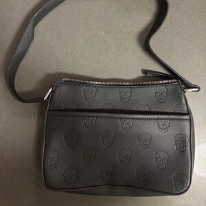 Black purse with skull design